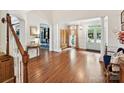 Inviting foyer featuring gleaming hardwood floors and natural light at 18419 Dembridge Dr, Davidson, NC 28036