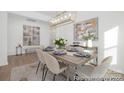 Elegant dining room with chandelier, stylish furnishings, and lots of natural light at 219 Tillery Ln # 755, Mount Gilead, NC 27306