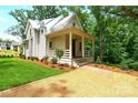 Home featuring a front porch, with green lawn and landscaped surroundings at 2268 New Gray Rock Rd, Fort Mill, SC 29708
