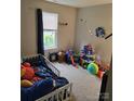 Bright bedroom featuring a window, toddler bed, and multiple toys and toy sets at 290 Greentree Dr, Rock Hill, SC 29730
