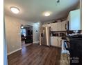 A well lit kitchen featuring stainless steel appliances and luxury vinyl plank flooring at 290 Greentree Dr, Rock Hill, SC 29730