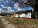 Charming single story home with brick foundation, small backyard and chimney at 306 E Arch St, Lancaster, SC 29720