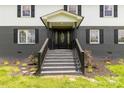 Inviting front porch with decorative door, complemented by landscaped garden and steps at 330 Skyview Dr, Catawba, SC 29704