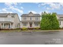 Inviting two-story home with a classic front porch and manicured bushes, perfect for curb appeal at 3906 Balsam St, Indian Trail, NC 28079