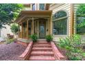 Close-up of the home's front porch, featuring brick steps and decorative railings at 416 E Park Ave, Charlotte, NC 28203