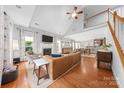 Spacious living room with vaulted ceilings, fireplace, hardwood floors, and plenty of natural light at 516 King St, Waxhaw, NC 28173