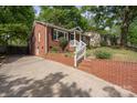 Beautiful brick home with a charming drive-up and landscaped yard at 534 W Kingston Ave, Charlotte, NC 28203