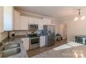 Modern kitchen with stainless steel appliances, granite countertops, and white cabinets at 5413 Austin Rd # 4, Monroe, NC 28112