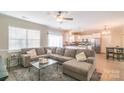 Bright living room showcasing a large sectional sofa, a plush rug, and ample natural light at 5413 Austin Rd # 4, Monroe, NC 28112