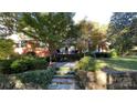 Inviting front entrance featuring stone steps, wrought iron railings, and mature trees at 700 Valleyview Dr # 1, Albemarle, NC 28001