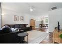 Open-concept living room seamlessly connects to dining area, creating an inviting space at 8381 Chatsworth Dr, Indian Land, SC 29707