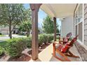 Inviting front porch with comfortable seating, offering a relaxing outdoor space at 8916 Inverness Bay Rd, Charlotte, NC 28278