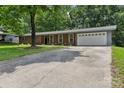Spacious ranch-style home featuring a long driveway, two-car garage, and well-maintained front lawn at 1192 Carolyn Dr # 9, Albemarle, NC 28001