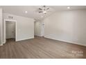 A view of the spacious living room with light-colored flooring and modern lighting at 1503 Doran Ter, Richburg, SC 29729