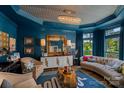 Stylishly designed living room with chic furniture, custom ceiling, and elegant decor at 17938 John Connor Rd, Cornelius, NC 28031