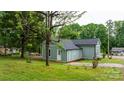Rear view of a newly renovated home with a well-maintained lawn at 18 S Coulter Ave, Newton, NC 28658