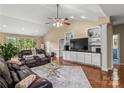 Spacious living room with vaulted ceiling, hardwood floors, and a cozy seating area at 1825 Smyre Farm Rd, Newton, NC 28658