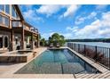 Stunning pool with adjacent hot tub overlooking the lake and offering a relaxing outdoor experience at 204 Ridge Dr # 12 12-1 12-2, Troy, NC 27371