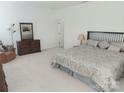 Spacious bedroom with a large bed, cozy armchair, dresser, and plush carpeting at 2061 Argentum Ave # 98, Fort Mill, SC 29707