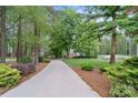 Long driveway leading to a secluded home surrounded by mature trees and landscaping at 2200 Capes Cove Dr, Sherrills Ford, NC 28673