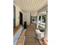 Spacious front porch with wood decking and decorative columns, perfect for relaxing outdoors at 273 E Main Ave, Taylorsville, NC 28681