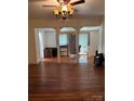 Living room showcasing hardwood floors and decorative columns creating an open feel at 273 E Main Ave, Taylorsville, NC 28681