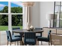 Inviting dining room showcasing a round table, comfortable chairs, and natural light at 4209 Pinekirk Dr # 374, Charlotte, NC 28269