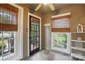 Bright sunroom with tile floors, bamboo shades and plenty of natural light at 4235 Howie Cir, Charlotte, NC 28205