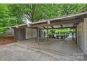 View of a carport offering covered parking and access to the pool area at 447 Merwick Cir, Charlotte, NC 28211