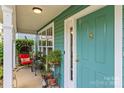 Charming front porch with a cozy seating area and a view of the neighborhood at 6827 Dunton St, Huntersville, NC 28078