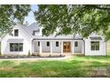 Charming two-story home with a large, inviting front porch and well-manicured lawn at 104 Arbor Dr, Waxhaw, NC 28173