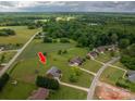 Aerial view of a house on a large lot surrounded by trees and fields at 1111 Lizzie Ln, Salisbury, NC 28147