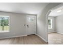 Bright entryway with modern flooring, fresh paint, and natural light at 12382 Ritchie Rd, Midland, NC 28107
