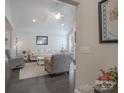 Bright living room with high ceilings, neutral furniture, and dark wood floors, creating an inviting space at 148 Adelaide Way, Rock Hill, SC 29732