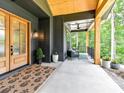 Charming front porch featuring elegant double doors and natural wood accents at 167 Greenbay Rd, Mooresville, NC 28117