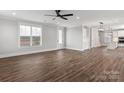 Bright open-plan living area with hardwood floors, recessed lighting, and large windows allowing ample natural light at 2092 Fordhill St, Rock Hill, SC 29732