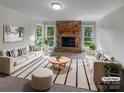Bright living room with stone fireplace, large windows, neutral decor, and stylish furnishings at 2532 Steeplechase Rd, Gastonia, NC 28056