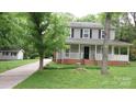 Charming two-story home with a welcoming front porch, brick accents, and a well-maintained lawn at 2716 Rea Rd, Charlotte, NC 28226