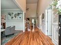 Bright foyer boasts hardwood floors, soaring ceiling, and decorative wall accents at 3409 Valdosta Ct, Monroe, NC 28110