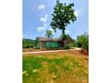 New construction home with a concrete walkway and landscaping at 401 Constant Ln, Charlotte, NC 28722