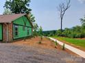 New construction home featuring stone accents and mountain views at 401 Constant Ln, Charlotte, NC 28722
