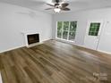 Bright living room featuring a fireplace and natural light at 524 N Portman Ln, Fort Mill, SC 29708