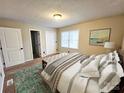 Cozy bedroom featuring a neutral palette, plush bedding, and ample natural light for a serene retreat at 7154 Woodcock Trl, Stanley, NC 28164