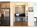 A kitchen view to an office featuring built-in cabinets and a desktop workspace at 7416 Hartsfield Dr, Lancaster, SC 29720