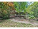 Charming home with a covered front porch and lush landscaping at 8504 Knollwood Cir, Charlotte, NC 28213