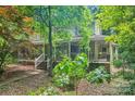 Charming home with a covered front porch and lush landscaping at 8504 Knollwood Cir, Charlotte, NC 28213