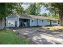 Exterior view featuring the home's driveway, covered carport, and manicured lawn at 875 Marys Grove Rd, Cherryville, NC 28021