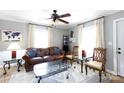Cozy living room featuring comfortable seating, a ceiling fan, and plenty of natural light at 118 Sunset Dr, Clover, SC 29710