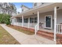 Inviting front porch with white railing, brick steps, and a 'Welcome' sign on the front door at 1230 Long Creek Ln, Salisbury, NC 28146