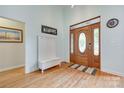 Inviting foyer with hardwood floors, a stylish wooden door, and a cozy bench at 1305 Yellowood Ct, Rock Hill, SC 29732